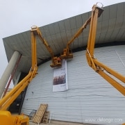 Installation bâche avec 2 nacelles — La pose idéale d'une BACHE sur FACADE COURBE