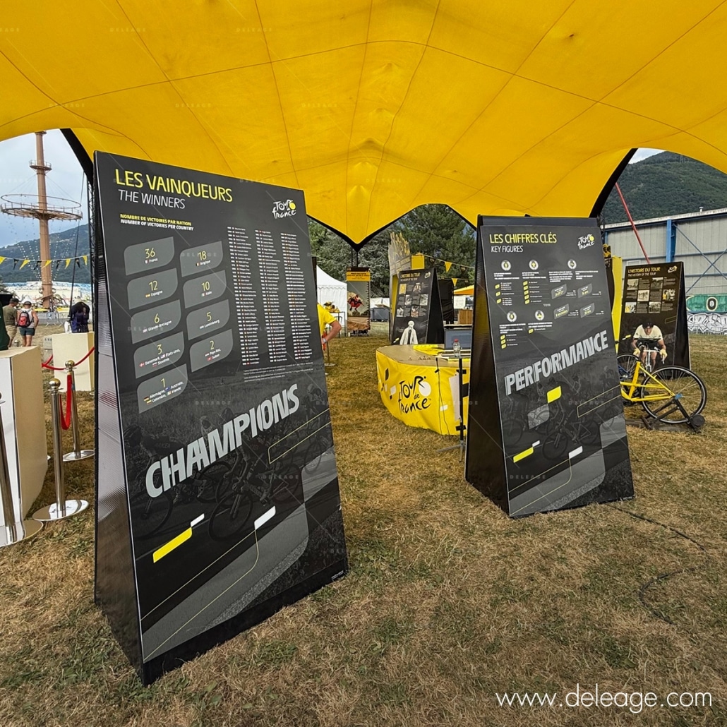 Totem-expo-exterieure (6) Totem expo extérieure — Le stand officiel de l’ETAPE DU TOUR 2025 (vue 6)